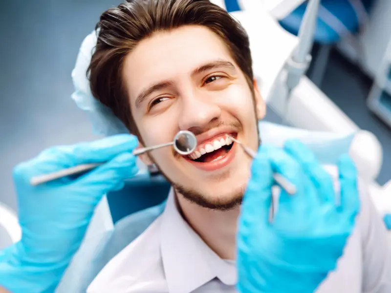 dental patient smiling before getting oral surgery in coral gables fl